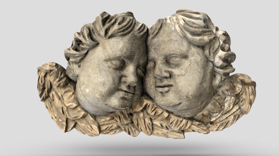 Two Heads of Angels in the Clouds