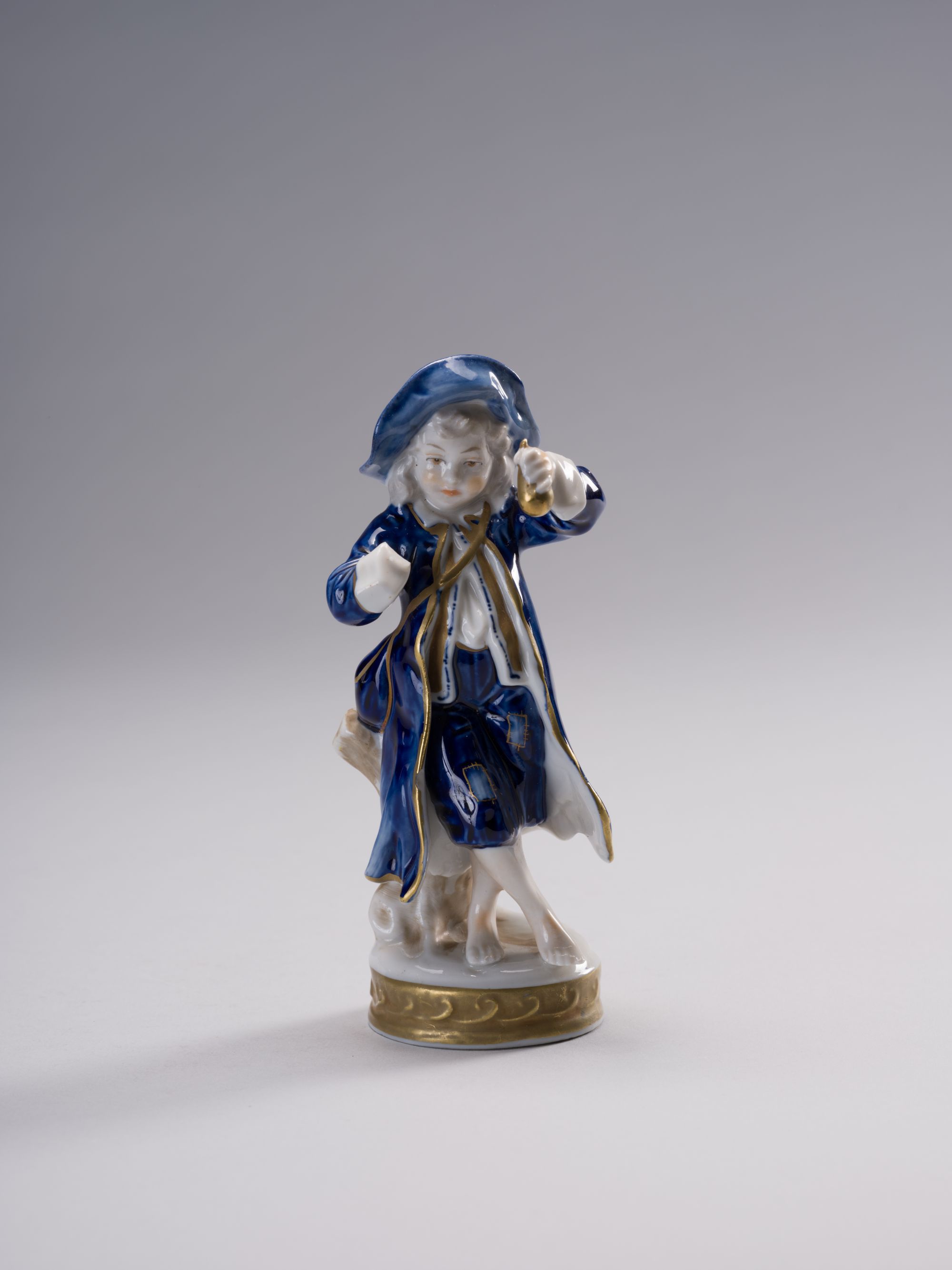 Boy with Fruits Figurine 1