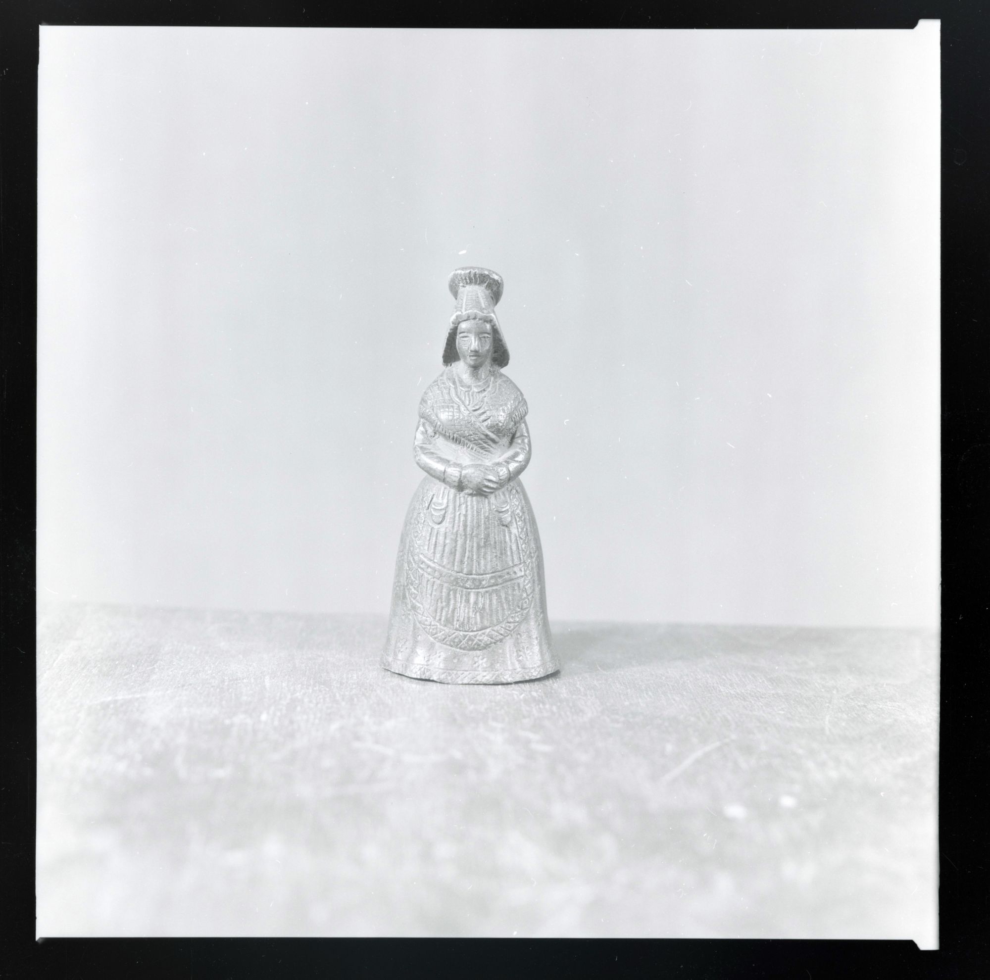 A Bell in the Shape of a Peasant Woman