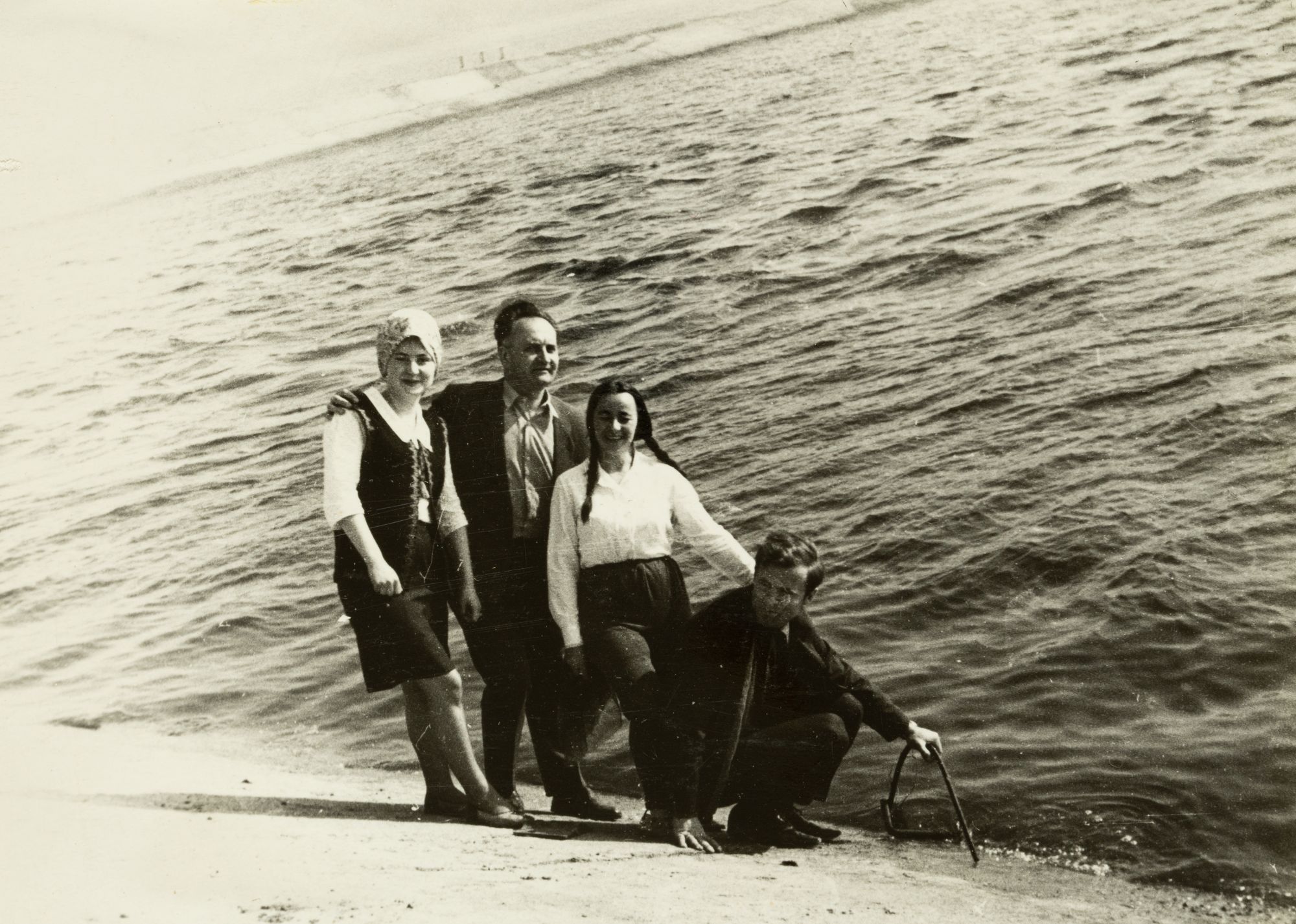 Group of People with Volodymyr Ovsiichuk on the Shore of a Pond